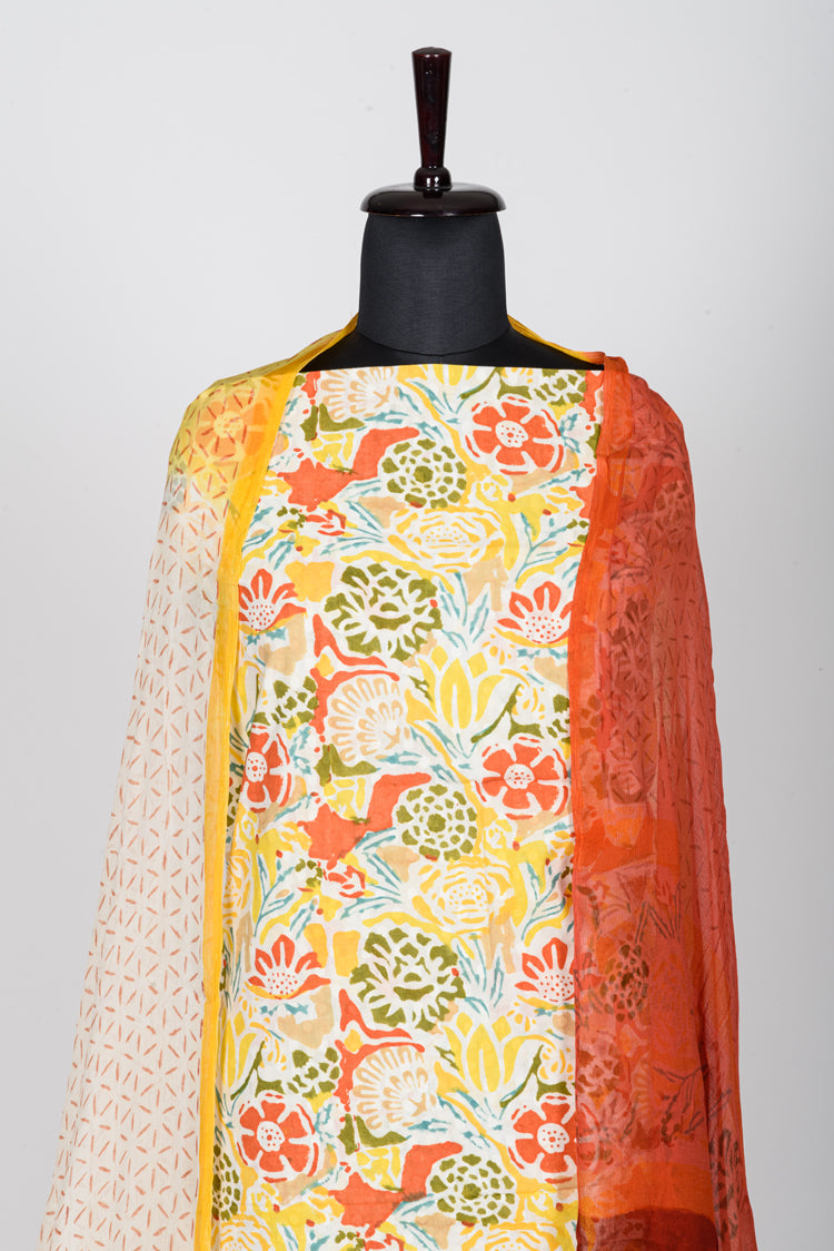 Beautiful Yellow Block Printed dress material in Cotton cambric with Chiffon dupatta.